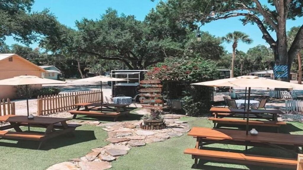 beergarden with tables and umbrellas.