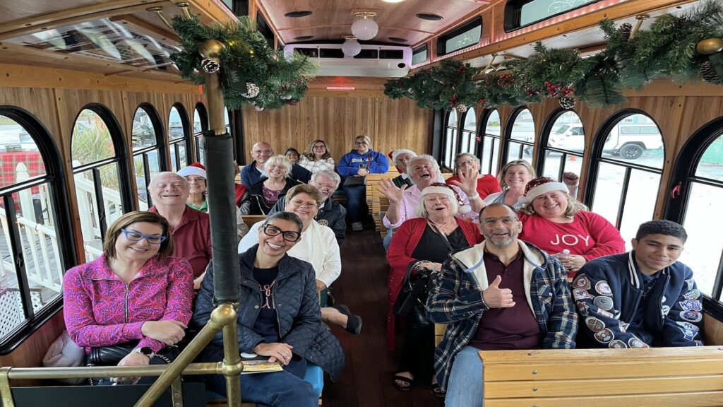 people sitting on a trolley