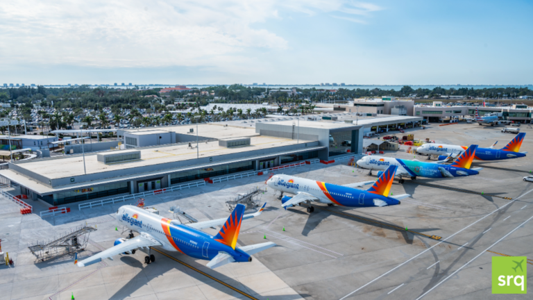 airplanes parked at a concourse.