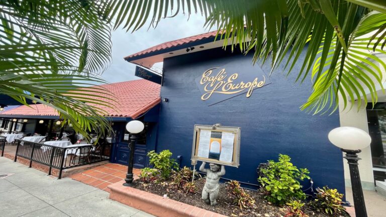 blue building with outdoor patio seating