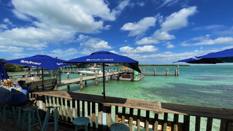 deck with blue sky and ocean bay.