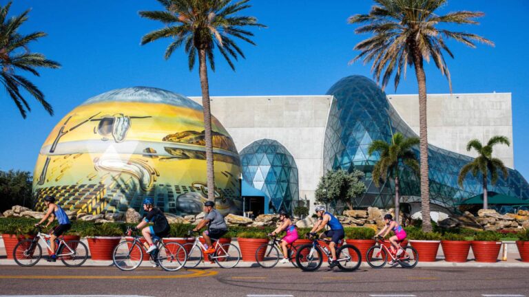 Bikers passing by a museum