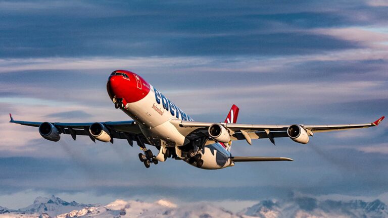 An airplane flying over the Alps
